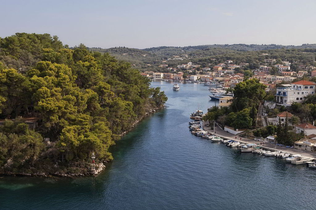 Paxoi. South of Corfu lies the island of Paxoi, a small enchanting island with jagged shoreline, sea caves and age-long trees. Local products such as wine and perfumed olive oil will tempt you. It is an unforgettable destination!