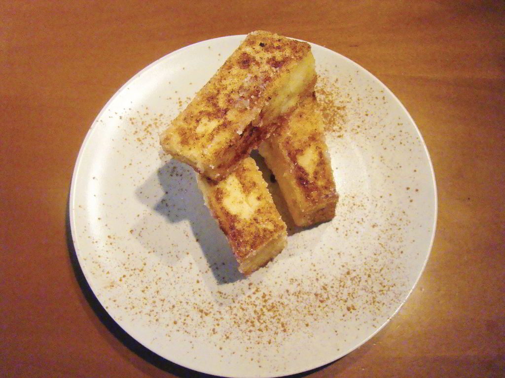 Fitouries medieval sweet made with fried semolina. It is served at every festive occasion sprinkled with sugar and cinnamon.